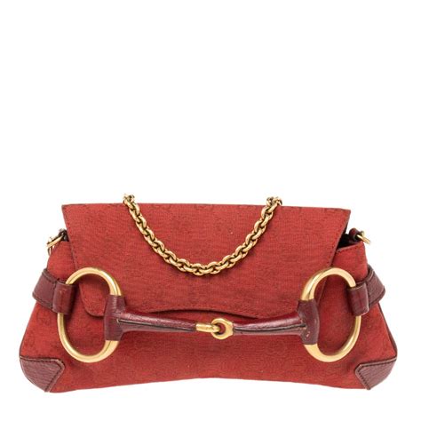 gucci red horsebit clutch|Gucci soho clutch.